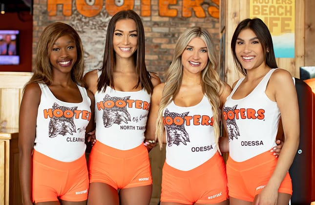 Hooters girls working at a Hooters restaurant