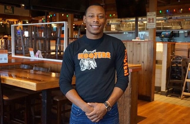 Kitchen staff at a Hooters restaurant