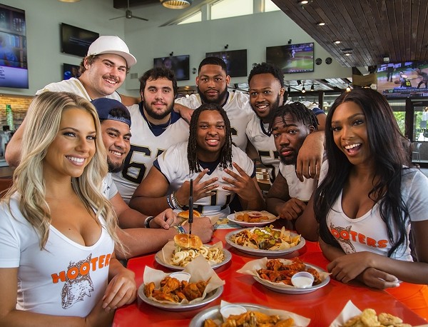 Hooters Signs Offensive Linemen– The Unsung Heroes of College Football – to NIL Deals Across the Country
